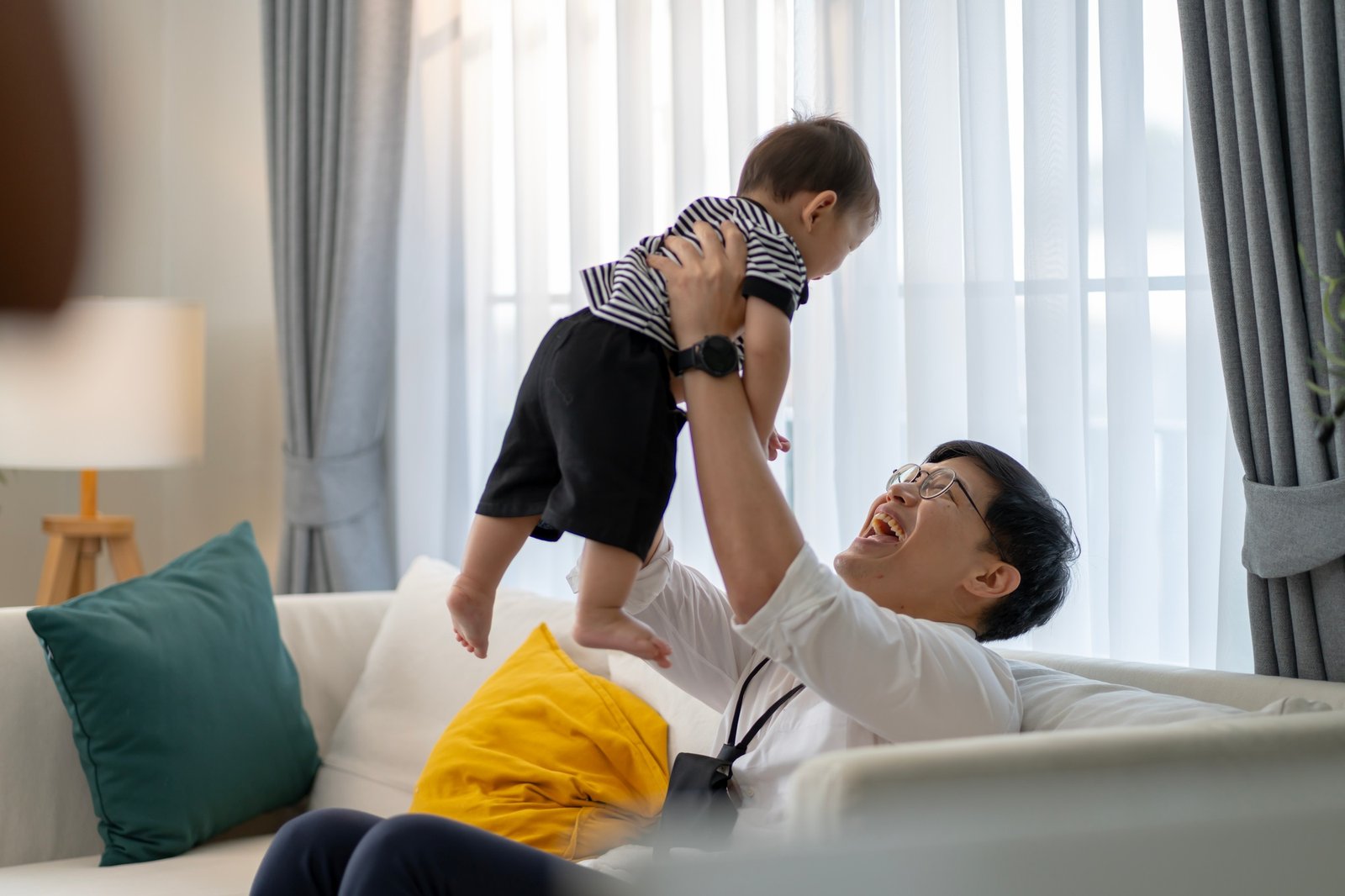 Asian baby and families who have to work while raising children at home